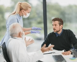 man consulting with a healthcare professional about health supplements